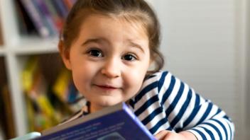 preschooler with picture book