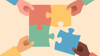 four hands putting together puzzle pieces