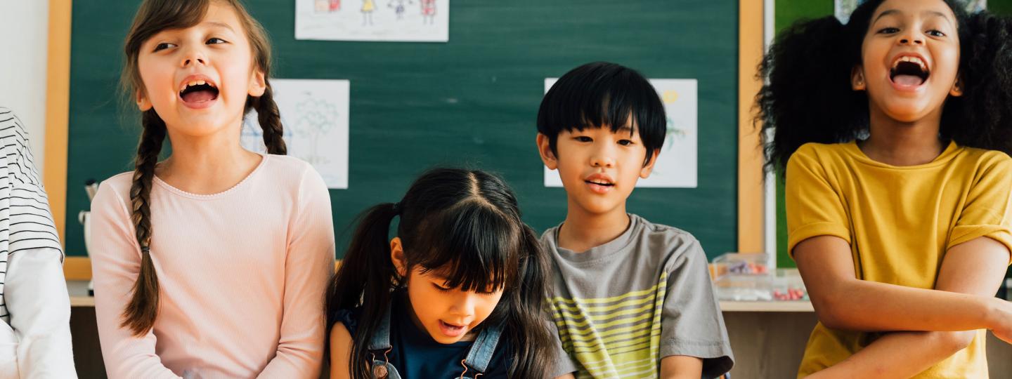Multicultural group of smiling elementary students
